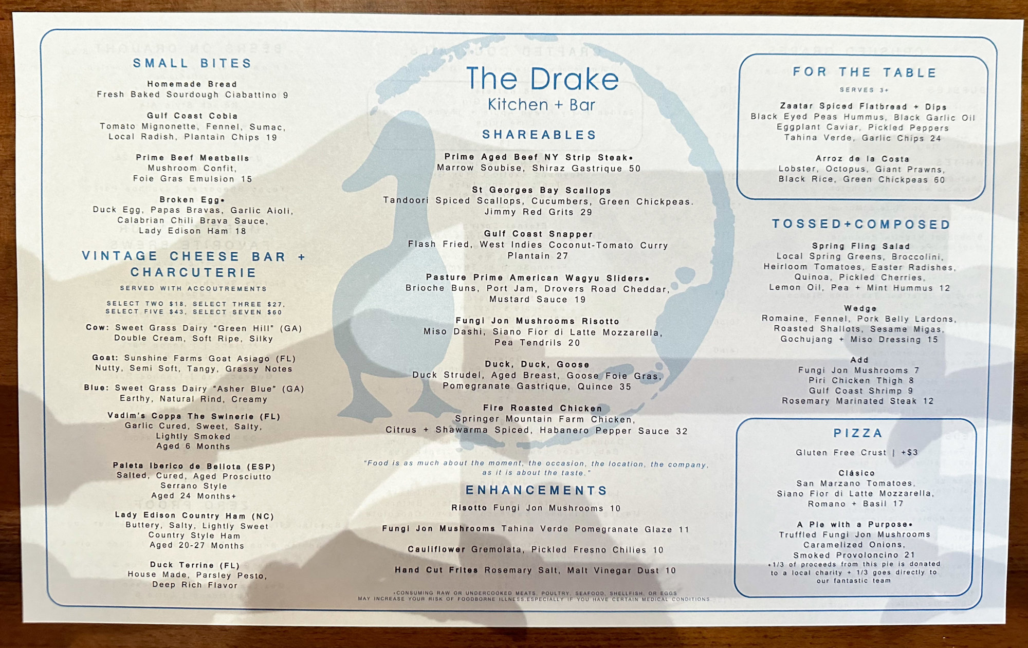 white menu with light blue duck as background